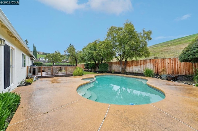 view of swimming pool with a patio