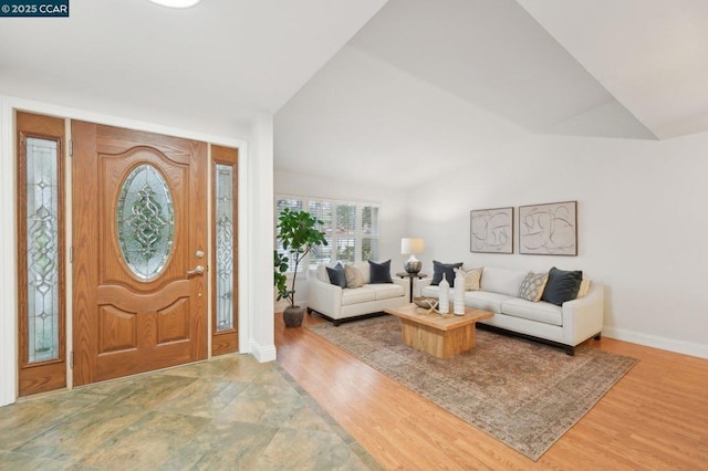 entryway featuring vaulted ceiling and hardwood / wood-style floors