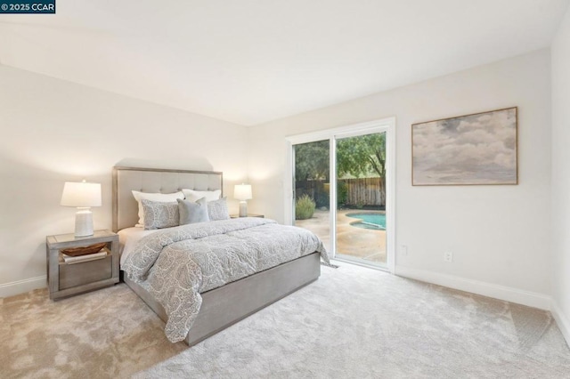 bedroom featuring access to outside and light colored carpet