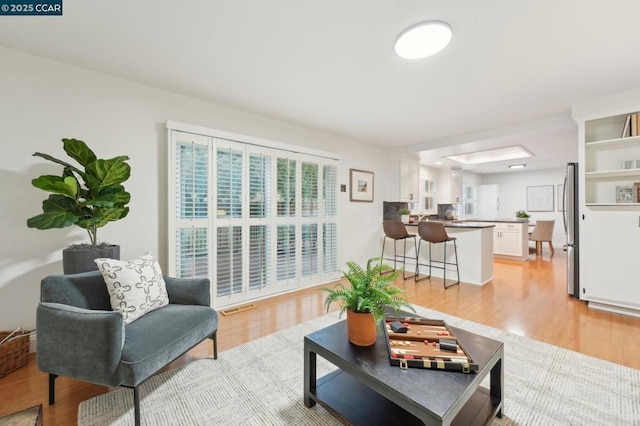 living room with light hardwood / wood-style flooring