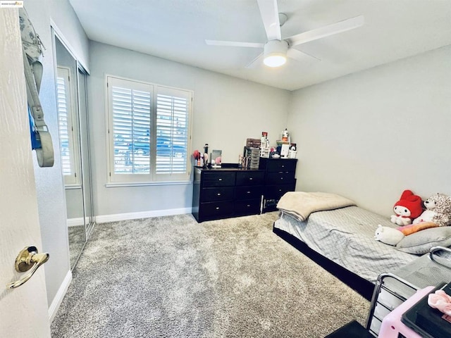 carpeted bedroom with a closet and ceiling fan