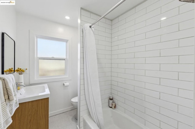 full bathroom featuring vanity, tile patterned floors, toilet, and shower / tub combo with curtain