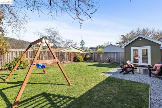 view of yard featuring an outdoor structure and a playground