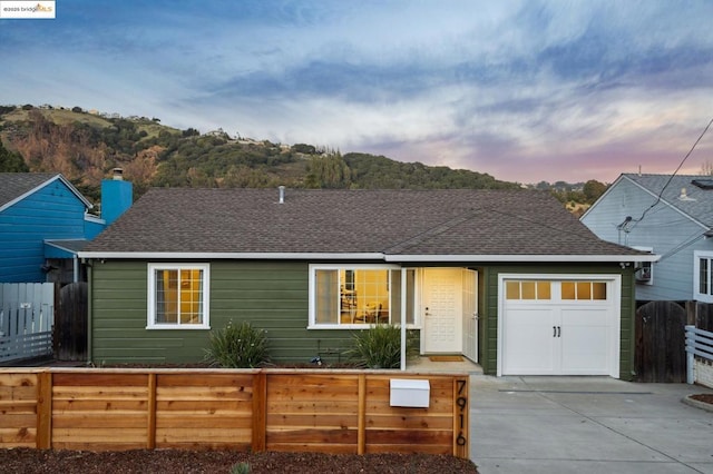 single story home featuring a garage