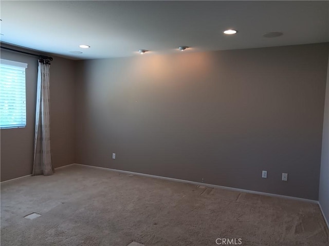 spare room with carpet flooring