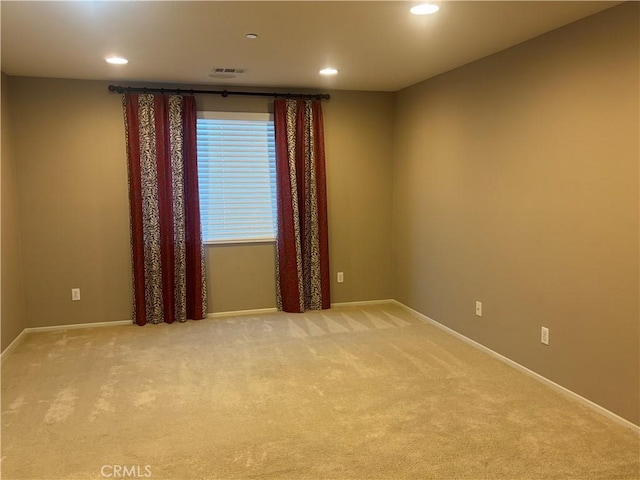 view of carpeted spare room