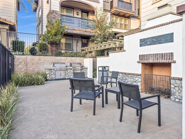 view of patio / terrace featuring area for grilling and exterior kitchen