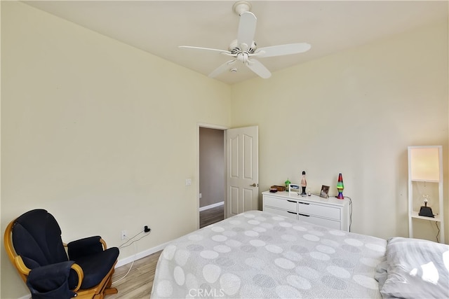 bedroom with hardwood / wood-style flooring and ceiling fan