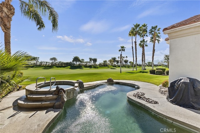 view of swimming pool with a lawn