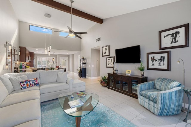 tiled living room featuring beam ceiling, high vaulted ceiling, and ceiling fan