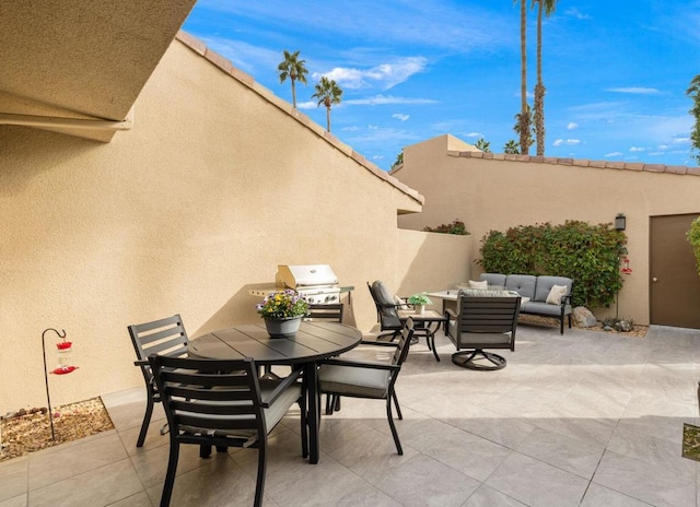 view of patio with area for grilling and an outdoor hangout area