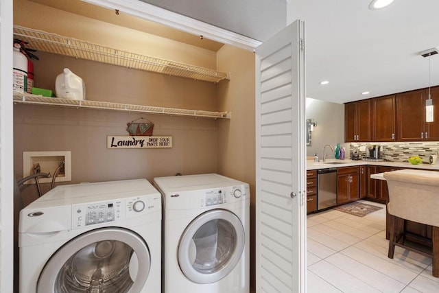 washroom featuring sink and independent washer and dryer