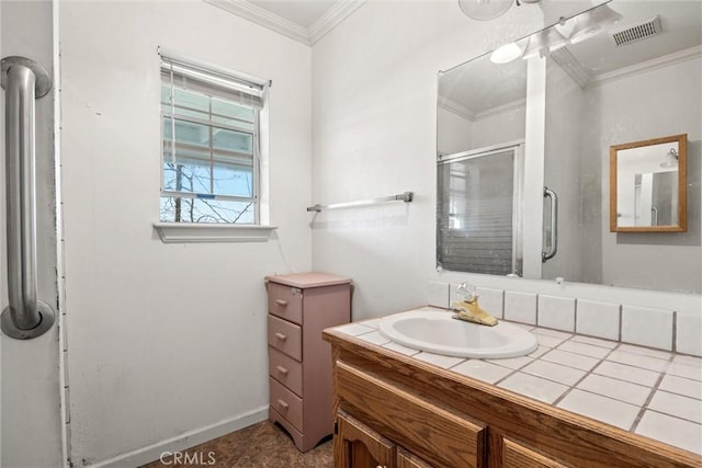 bathroom featuring ornamental molding, an enclosed shower, and vanity