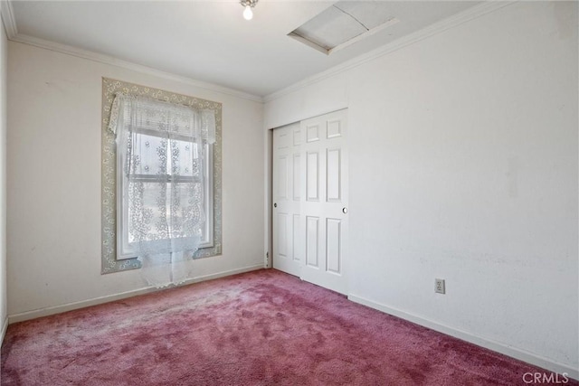 empty room with ornamental molding and carpet