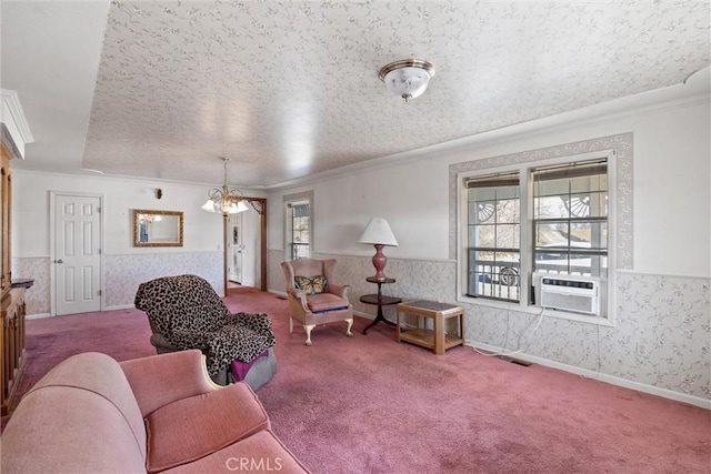 carpeted living room featuring cooling unit, crown molding, a textured ceiling, and an inviting chandelier