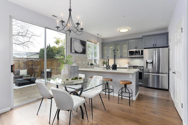 dining room with a chandelier and hardwood / wood-style floors