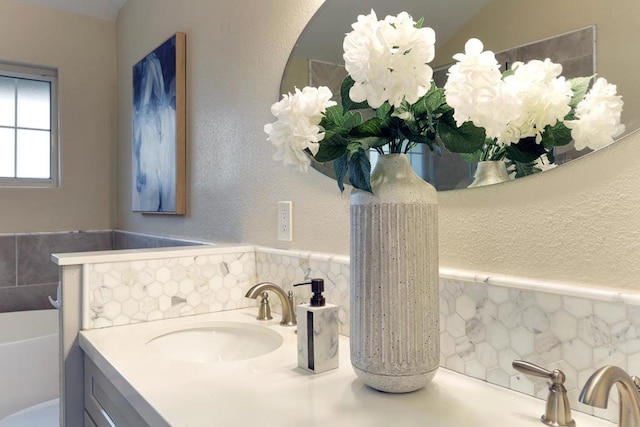 bathroom with vanity and tile walls