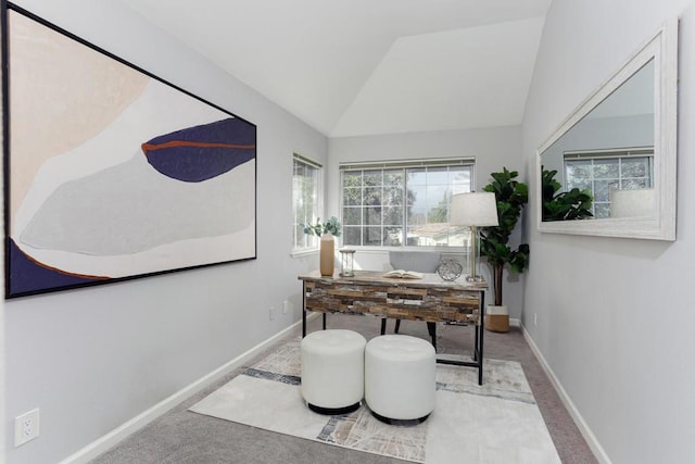 carpeted office space with lofted ceiling