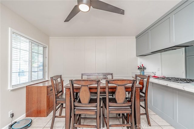 tiled dining area featuring ceiling fan