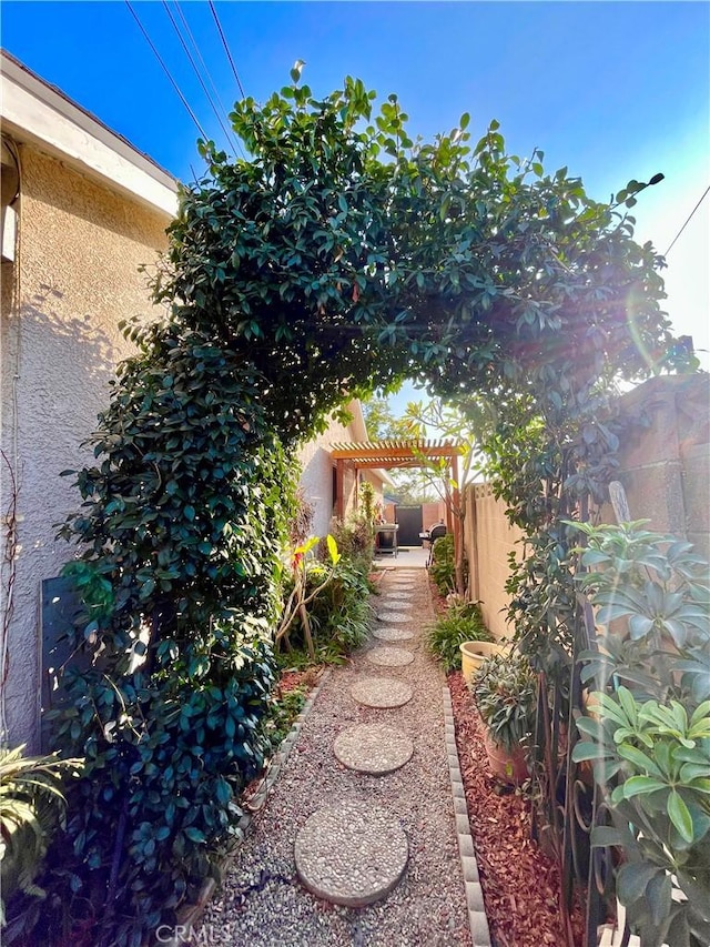 view of yard with a pergola and a patio area