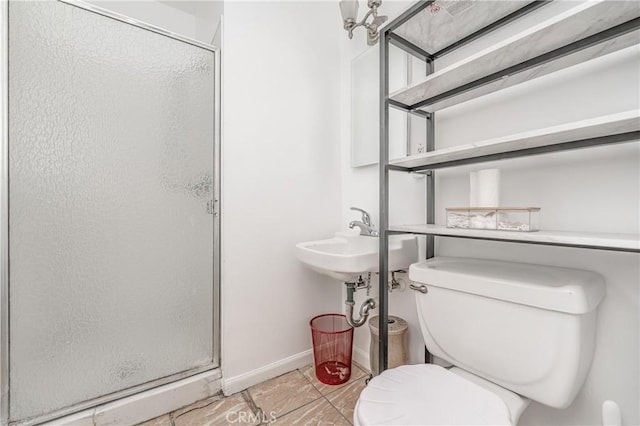 bathroom with sink, an enclosed shower, tile patterned floors, and toilet