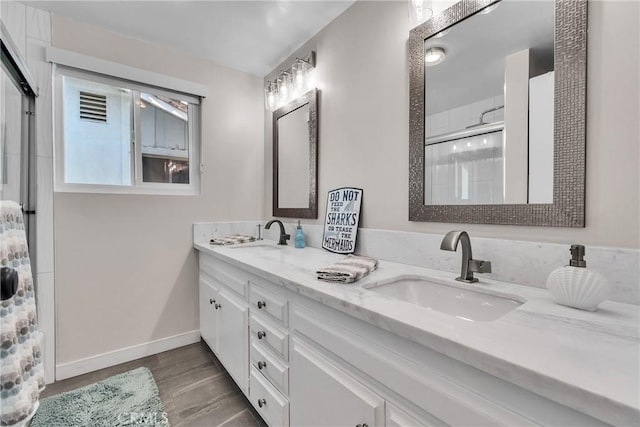 bathroom with vanity and an enclosed shower