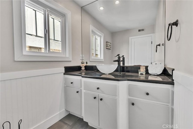 bathroom with vanity and tile patterned flooring