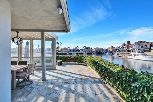 view of patio with a water view