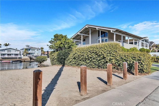 4051 Davenport Dr, Huntington Beach, CA 92649 - view of front facade featuring a water view