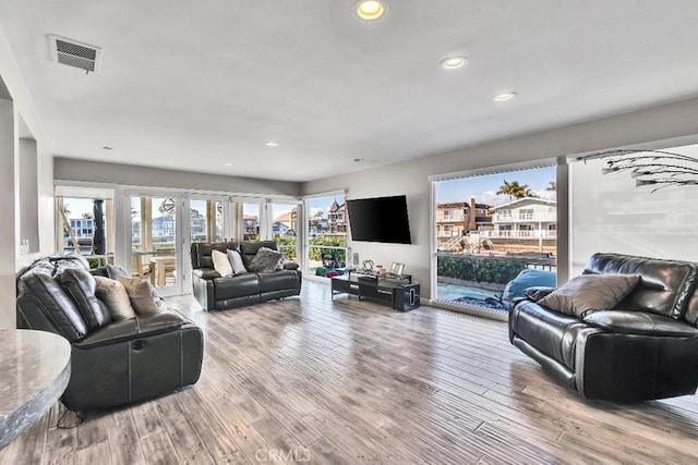 living room with light hardwood / wood-style flooring