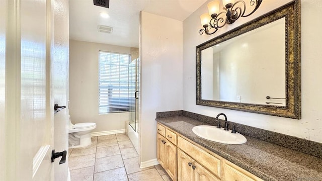 full bathroom featuring shower / bath combination with glass door, vanity, toilet, and tile patterned flooring