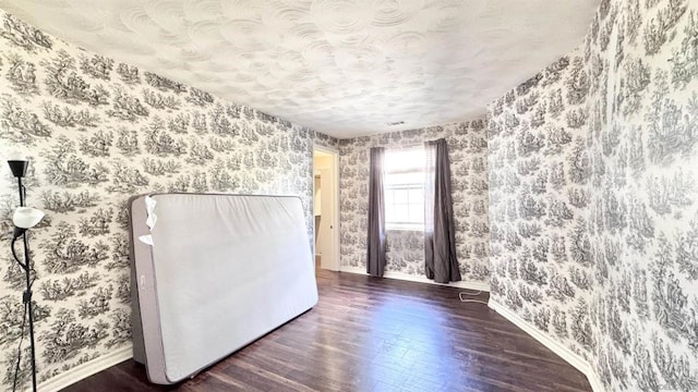 empty room featuring dark hardwood / wood-style flooring