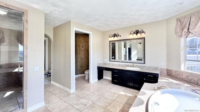 full bathroom featuring vanity, separate shower and tub, tile patterned floors, and toilet