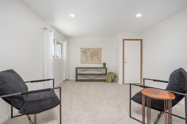 sitting room with light carpet