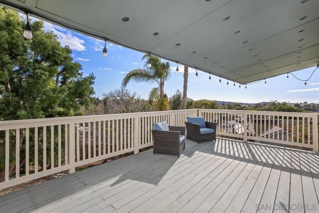 wooden deck featuring an outdoor living space