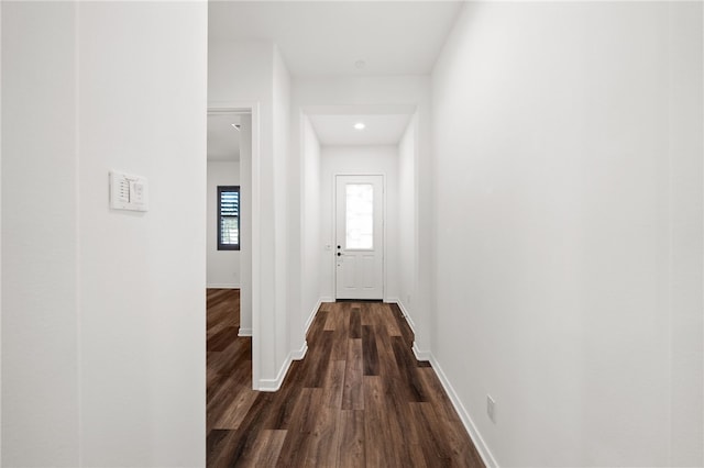 hallway with dark wood-type flooring