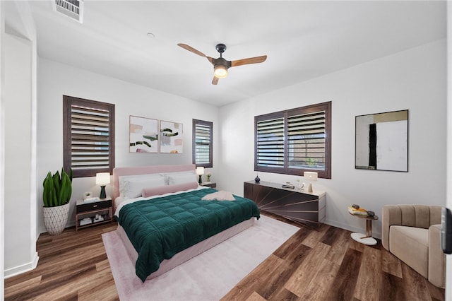 bedroom featuring hardwood / wood-style floors and ceiling fan