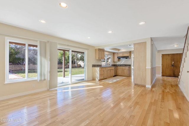 unfurnished living room featuring light hardwood / wood-style flooring