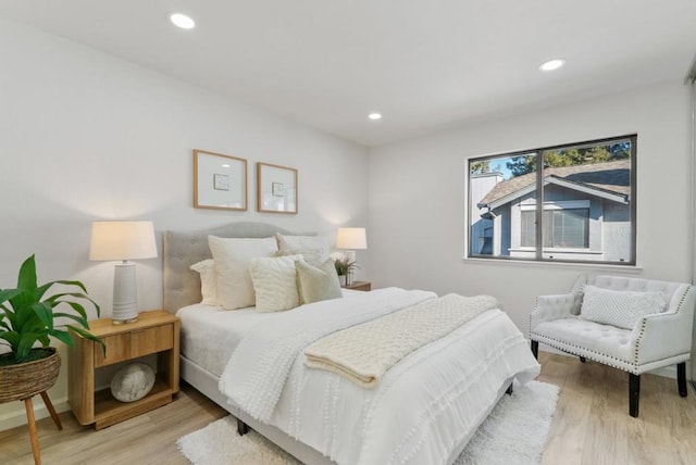 bedroom with light hardwood / wood-style floors