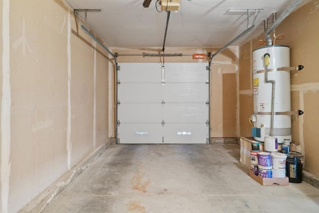 garage featuring water heater and a garage door opener