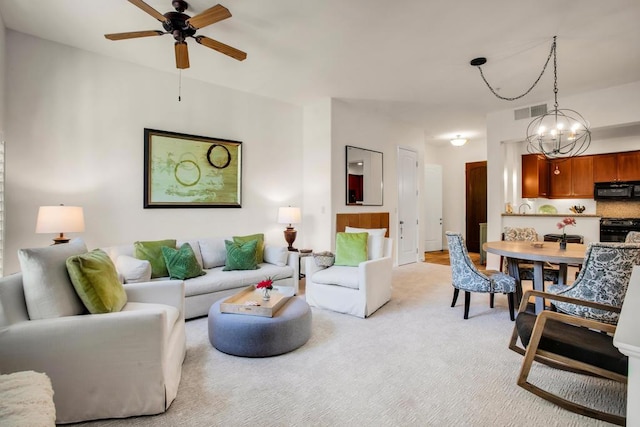 living room featuring ceiling fan and light carpet