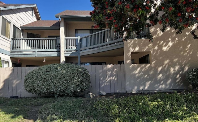 view of home's exterior with a balcony