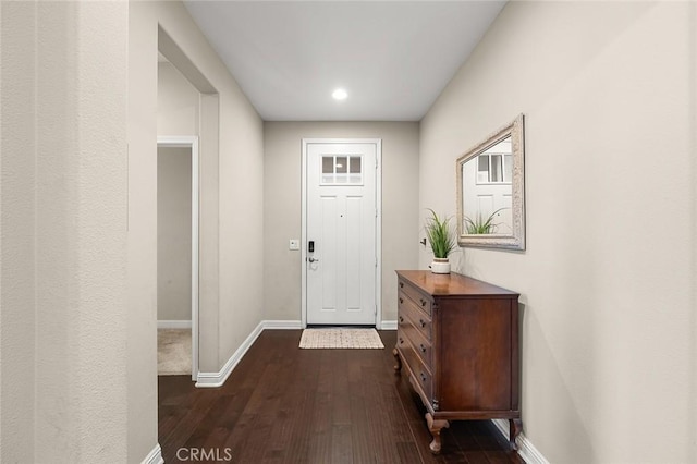 foyer entrance with dark hardwood / wood-style floors