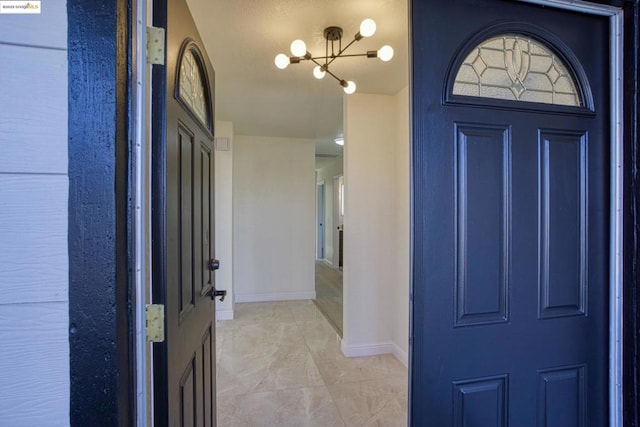 entrance foyer with a chandelier