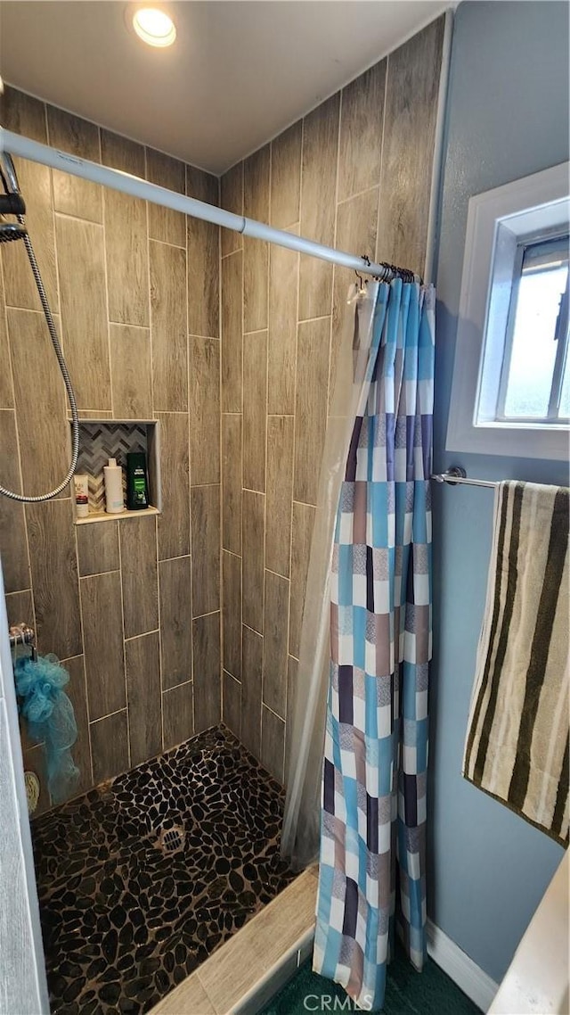 bathroom featuring a shower with curtain