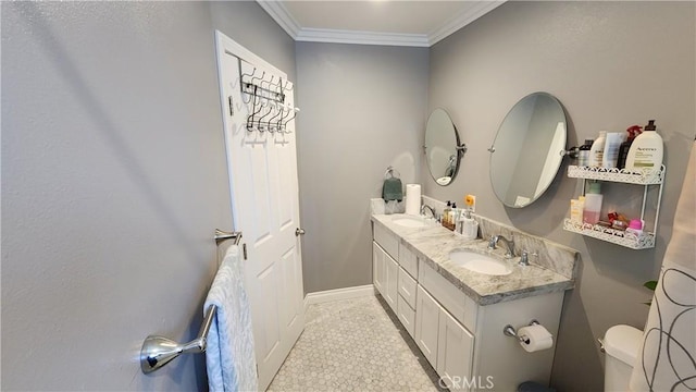 bathroom with ornamental molding, toilet, and vanity