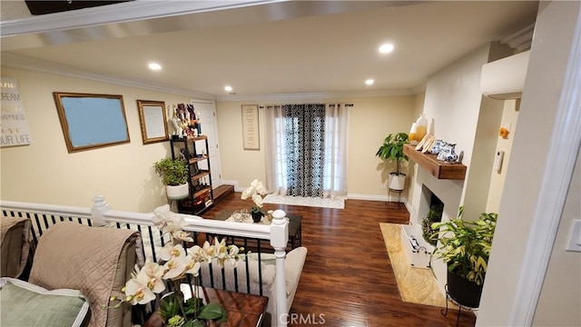 living room featuring dark hardwood / wood-style flooring and crown molding