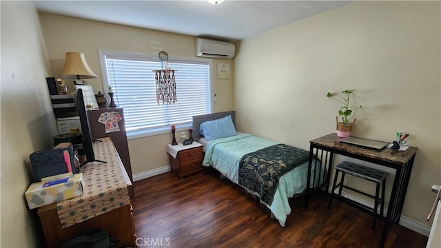 bedroom with a wall mounted air conditioner and dark hardwood / wood-style floors