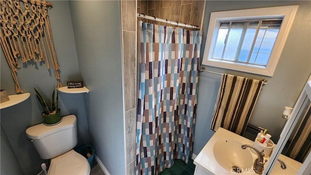 bathroom featuring walk in shower, vanity, and toilet