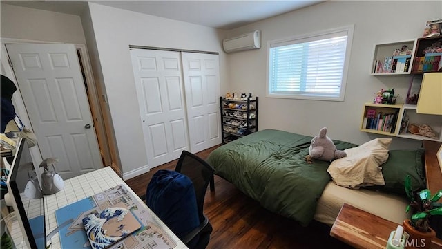 bedroom featuring dark hardwood / wood-style flooring, a closet, and an AC wall unit